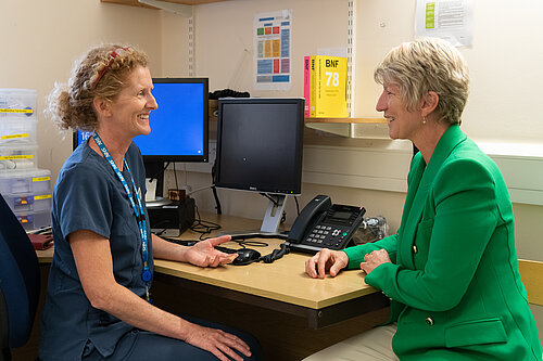 Pippa Heylings in a GP surgery, the GP is on the left and Pippa is sitting to her right